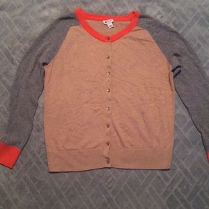 I’m selling a tan colored button up sweater.